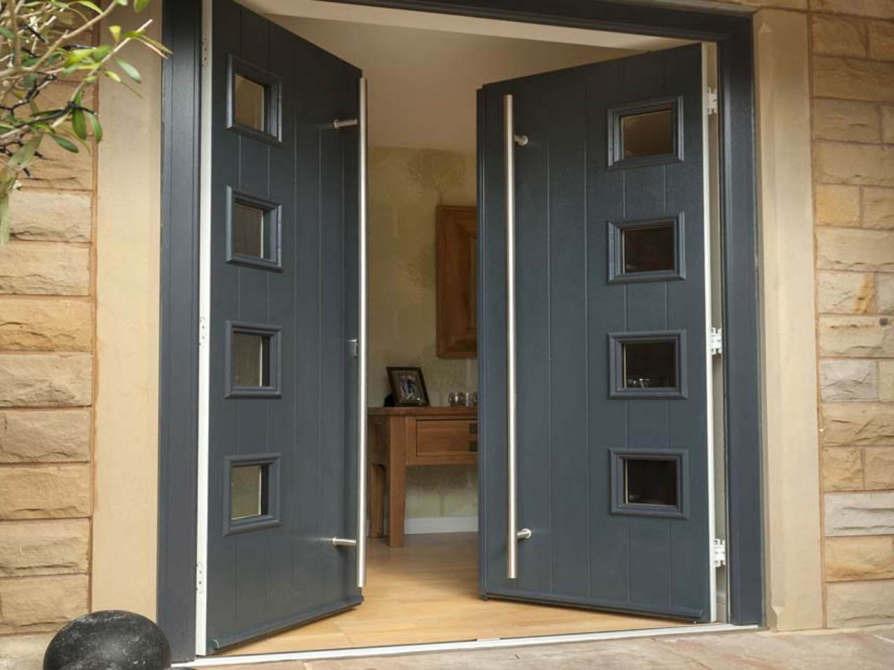 black composite double doors in the open position